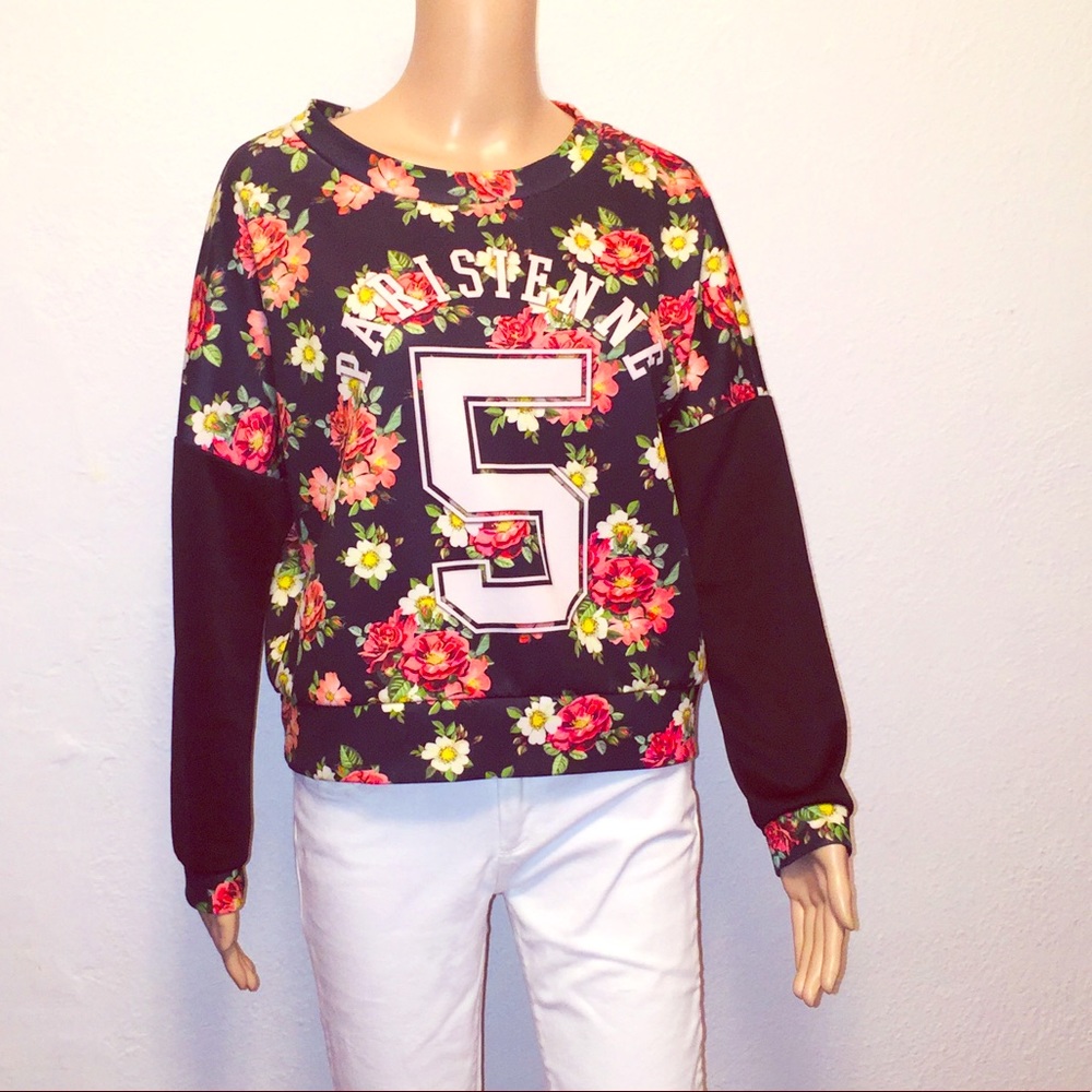 Floral pullover Size M.
